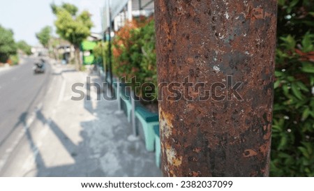 rusty iron background is on the street sidewalk