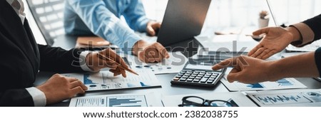 Auditor and accountant team working in office, analyze financial data and accounting record with calculator. Accounting company provide finance and taxation planning for profitable cash flow. Insight Royalty-Free Stock Photo #2382038755