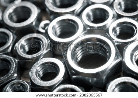 Close up of some metal nuts for fixing of fasteners Royalty-Free Stock Photo #2382065567