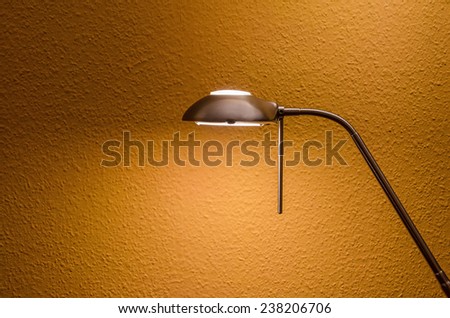 modern lamp in front of a textured wall