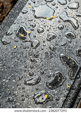 rain drops on a metal surface.