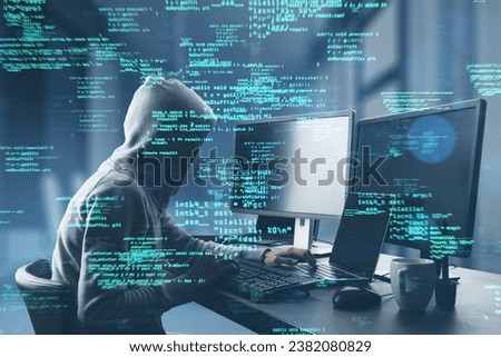 Side view of hacker at desk using computers with creative coding html language on blurry office interior background. Web developer, hacking, malware and programming concept. Double exposure