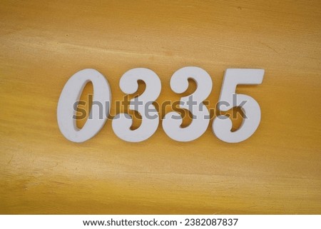 The golden yellow painted wood panel for the background, number 0335, is made from white painted wood.