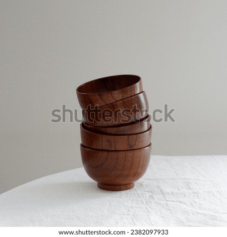 wooden bowls stacked on a table Royalty-Free Stock Photo #2382097933