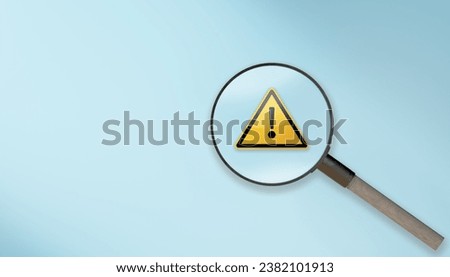 magnifier glass with yellow triangle caution warning sign for notification error and maintenance concept. magnifying glass and with exclamation attention sign. Root cause analysis or solving problem Royalty-Free Stock Photo #2382101913