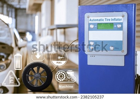 Inflator machine car inspection Measure quantity Inflated Rubber tires car.Close up hand holding machine Inflated pressure gauge for car tyre pressure measurement for automotive, automobile image Royalty-Free Stock Photo #2382105237