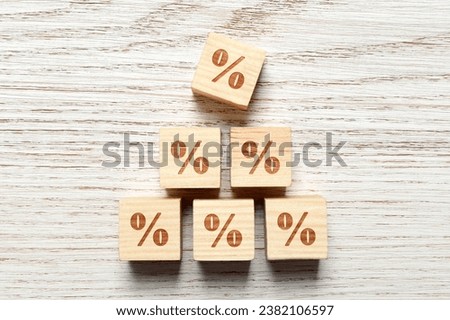 Cubes with percent signs on white wooden background, top view