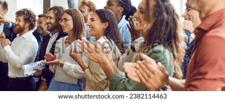 Applauding people. Happy satisfied audience joyfully applauding during business conference or seminar. Side view portrait of smiling men and women clapping their hands. Panoramic web banner. Royalty-Free Stock Photo #2382114463