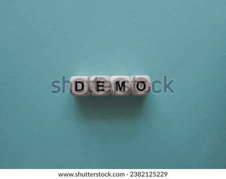 Demo. Cubes form the word Demo. An extensive concept of the word demo applied in different fields of activity. Blue background.