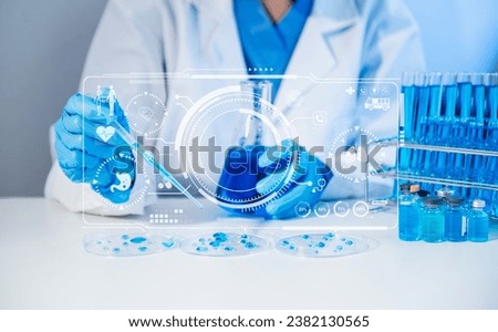 Scientist mixing chemical liquids in the chemistry lab. Researcher working in the chemical laboratory and new chemical substances with virtual icon


