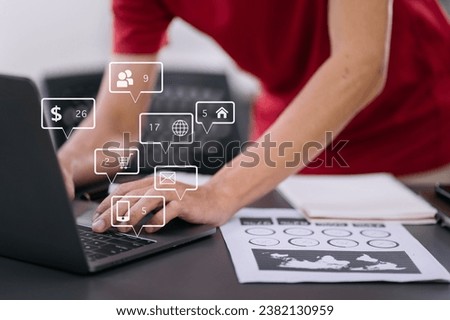 Social media and Marketing virtual icons screen of businessman typing keyboard with laptop computer at office at morning light.