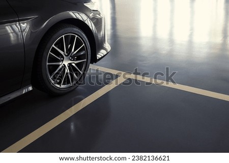 close up of modern car in parking lot, anti slip coating floor for safety