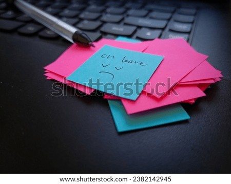 sticky note with an expression of fatigue after hard work, on the desktop
