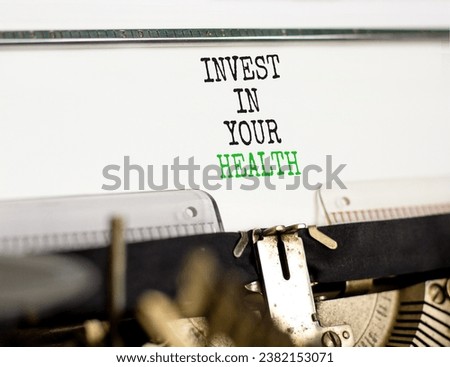 Invest in your health symbol. Concept word Invest in your health typed on beautiful old retro typewriter. Beautiful white paper background. Invest in your health concept. Copy space.