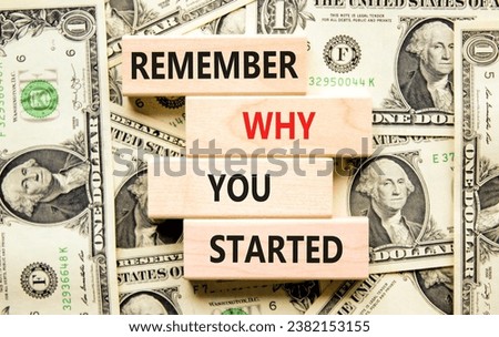 Remember why you started symbol. Concept word Remember why you started on wooden block. Dollar bills. Beautiful background from dollar bills. Business remember why you started concept. Copy space.