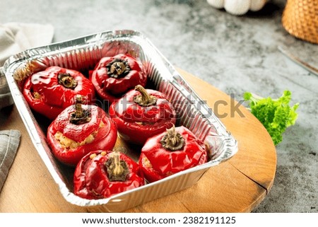 Stuffed peppers minced meat with pearl barley in form. Red Bulgarian pepper.  National cuisine Royalty-Free Stock Photo #2382191125