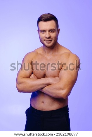 A Confident Man Striking a Pose for a Captivating Portrait. A man with his arms crossed posing for a picture