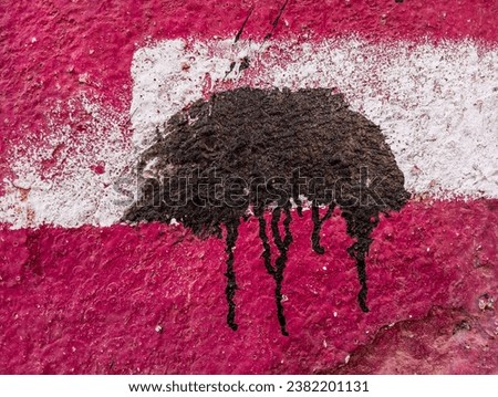 Abstact paint grunge background. Weathered dirty red painted cement wall with black paint stains. Aged damaged cement wall texture.