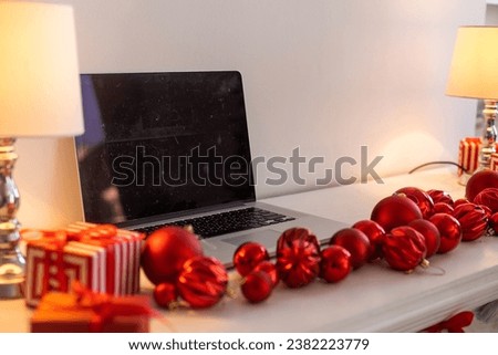 Christmas decorated working space with a laptop on the desk, social media holiday concept with blank space for a text