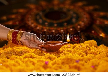 Clay diya lamps lit during diwali celebration, Diwali, or Deepavali, is India's biggest and most important holiday. Royalty-Free Stock Photo #2382229169