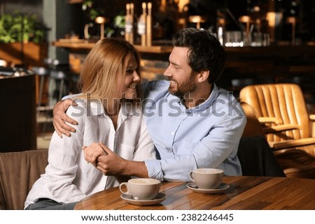 Romantic date. Lovely couple spending time together in cafe Royalty-Free Stock Photo #2382246445