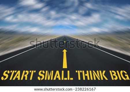 road with sign start small think big concept