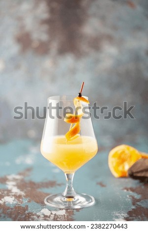 Boozy Corpse Reviver No 2 Cocktail with Gin and Lemon in Cocktail glass. Alcoholic drink and bar tools. Royalty-Free Stock Photo #2382270443