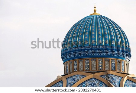The upper part of the mosque with beautiful turquoise dome.