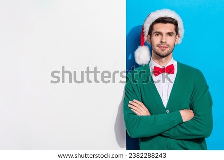 Photo of attractive serious brunet arm crossed stand big poster placard empty blank space season discount isolated on blue color background