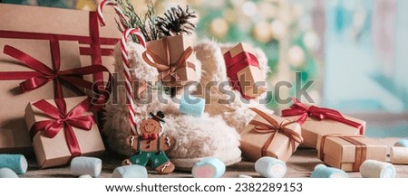 St. Nicholas Day.Boots with sweets and gifts on the floor in the room, St. Nicholas Day greeting card,Christmas Eve,sinterklaas Royalty-Free Stock Photo #2382289153