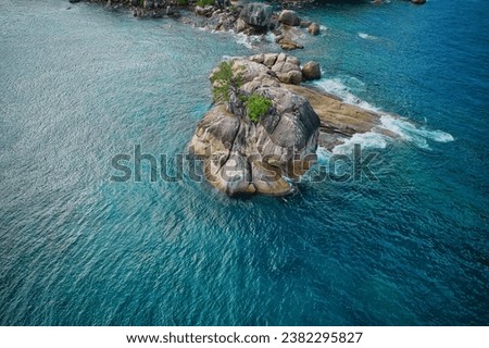Drone bird eye view at Anse solei beach, turquoise and calm sea and huge granite stones with trees, Mahe Seychelles 1