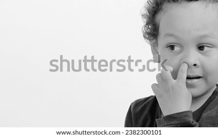 boy picking his nose with people on white background stock image stock photo