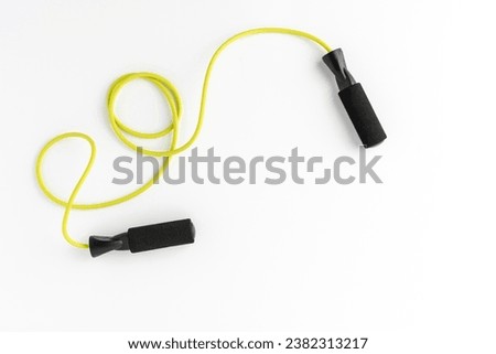 Jumping rope isolated on white background. Fitness concept Royalty-Free Stock Photo #2382313217