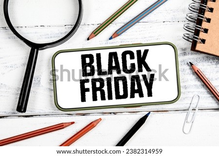 Black Friday Concept. Sale, internet search. mobile phone on wooden background.