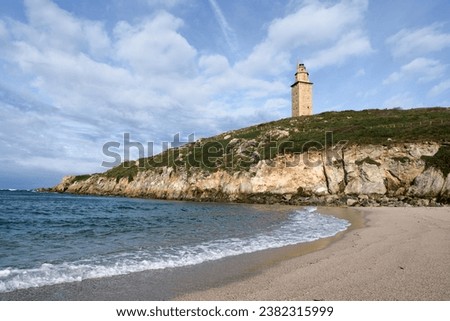 View of Hercules tower roman lighthouse from Lapas beach in the city of a coruna in a sunny day, Galicia, Spain.  Royalty-Free Stock Photo #2382315999