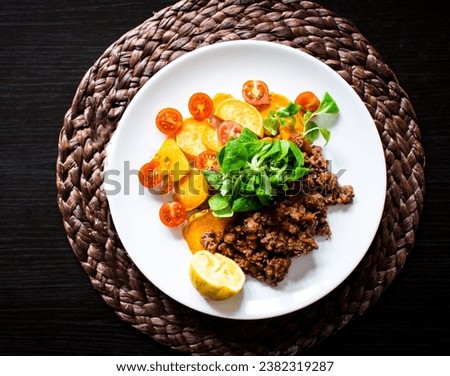 BBQ Outdoor with food preparations. People eating and dining outdoor. Lots of vegetables, fish, and meat. Royalty-Free Stock Photo #2382319287