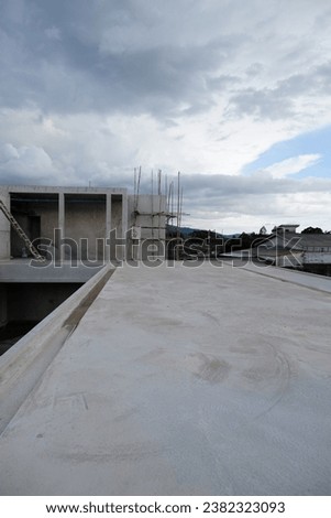 New residential construction home.concrete roof slab in construction. Royalty-Free Stock Photo #2382323093