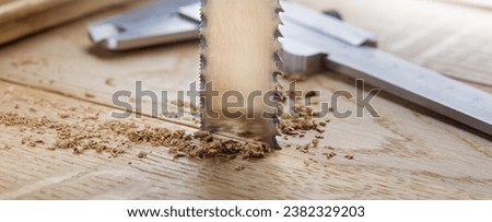 metal band saw cut wood oaks plank with shavings. Royalty-Free Stock Photo #2382329203