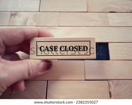 Social issues, law and justice concept. CASE CLOSED written on wooden blocks. With blurred styled background. Royalty-Free Stock Photo #2382355027