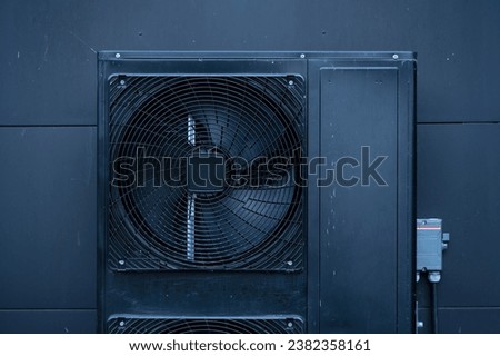 Black exterior inverter air conditioning unit.