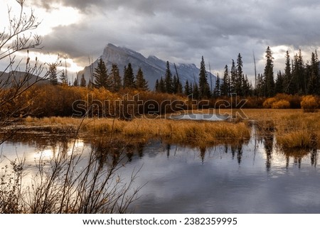 Beautiful autumn landscape. Vermilion Lake under rain, Banff National Park in Alberta, Canada Royalty-Free Stock Photo #2382359995