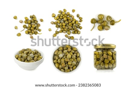 Pickled capers pile isolated. Marinated caper buds, small salted capparis, fermented food, pickled capers group on white background top view Royalty-Free Stock Photo #2382365083
