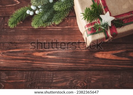 Christmas background with gift box and fir branches. Xmas and New Year theme. Space for text.