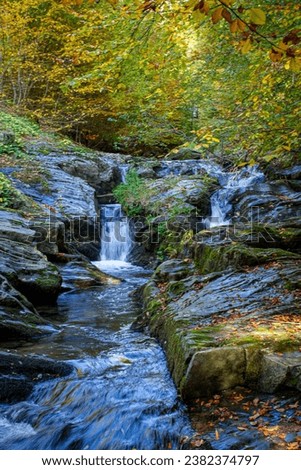 Autumn landscape with a mountain river, Waterfall and  rocks in the forest. near Stip, Macedonia