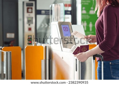 Passenger Safely Checking Passport at Automated Gate at the Airport - Traveling Documents. Royalty-Free Stock Photo #2382390935