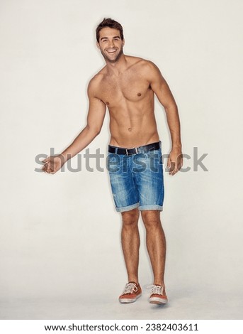 Smile, topless and portrait of man or model for fitness, sports or muscle on a studio background. Health, cool and a guy or person with abs or stomach from exercise, training or shorts on a backdrop Royalty-Free Stock Photo #2382403611