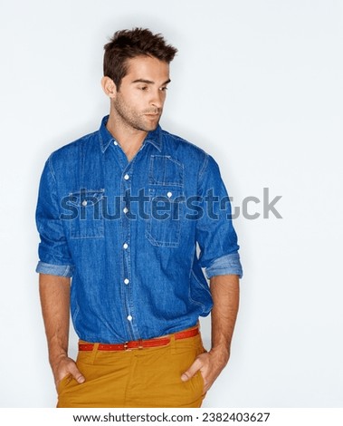 Thinking, stylish and a man with clothes for fashion, trendy and denim on a white background. Young, cool and a person or model with an idea, shirt or hipster clothing on a backdrop for style