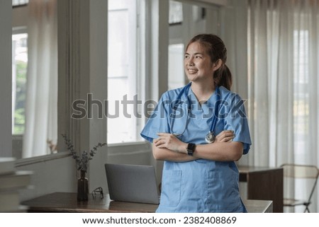 Smiling female doctor wearing a stethoscope in the doctor's office in the hospital