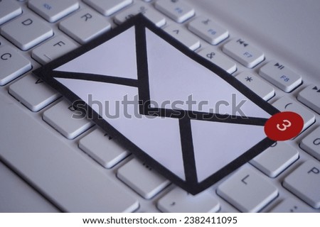 New email notification on top of keyboard. Communication and technology concept