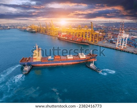 Large cargo ships are docked at a large export warehouse in an industrial zone.	 Royalty-Free Stock Photo #2382416773